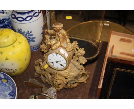 A late 19th Century gilt metal two hole mantel clock mounted with a figure  AF, with keys and pendulum