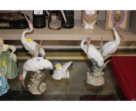 Four Lladro ornaments, each in the form of cranes 