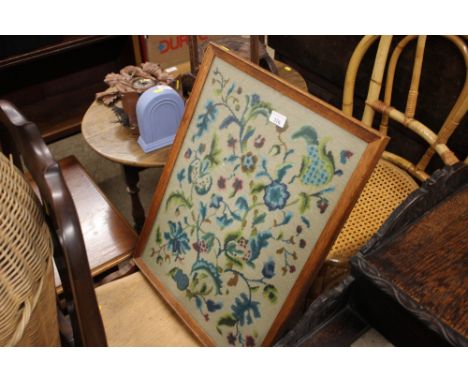 An elm seated slat back kitchen chair; and an oak framed fire screen with needlework panel