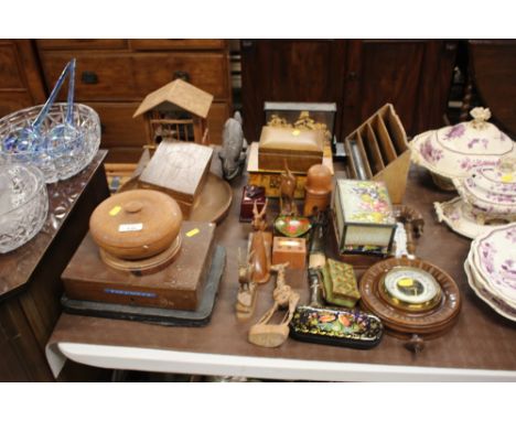 A quantity of various wooden ware to include a barometer; stationary rack; decorative trinket boxes; oriental cork diorama et