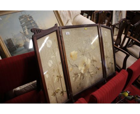 An early 20th Century mahogany framed and silk work embroidered fire screen AF