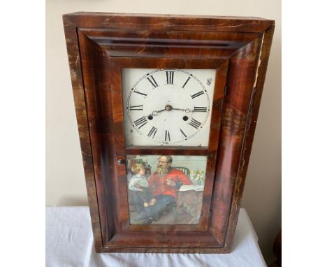 An American Seth Thomas wall mounted cased clock with walnut veneer and Victorian print to door panel. Approx. 43cms h x 39cm