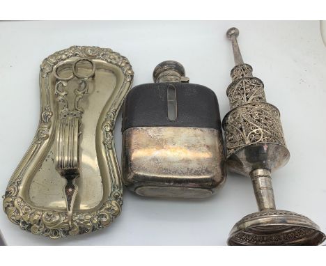 A plated candlesnuffer on a tray, a leather and plated hip flask and a white metal filigree incense burner 24.5cms h. Not tes