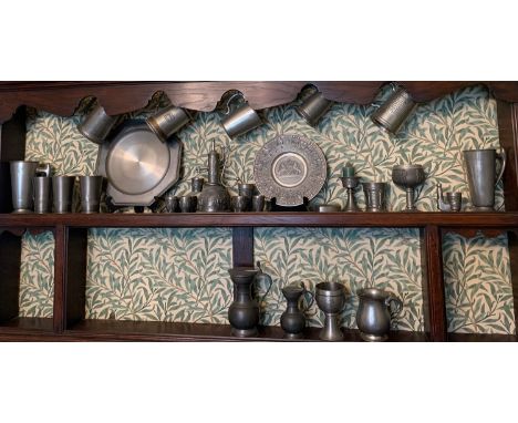 A large collection of 20thC pewter to include lidded jugs, tankards etc.Condition ReportCandelabra with dent to base.
