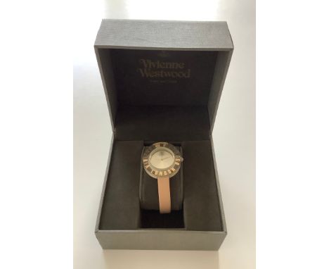 A Vivenne Westwood Time Machine ladies wrist watch with pale pink leather strap and gold details to clock arms, logo and face