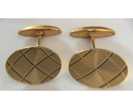 A pair of boxed 9ct gold cufflinks London 1977 with etched decoration. 8gms.Condition ReportGood condition.