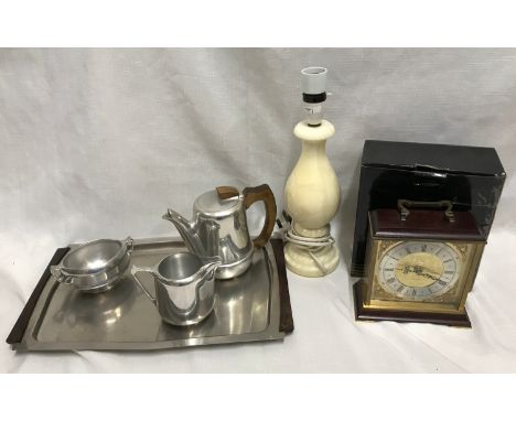 Picquot three piece tea set on steel tray, an onyx table lamp 33cm h and a Metamec chiming mantle clock 16cm w x 16.5cm h.Con