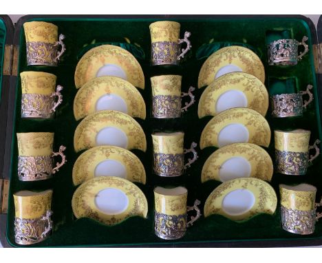 A part boxed Staffordshire eggshell coffee service in hallmarked silver holders Birmingham 1898 by maker William Comyns. Silv