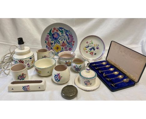 A collection of 11 Poole pottery to include a lamp base 19cms, 2 x cream jugs, 3 x sugar bowl, pot, plate 25.5cm, side plate,