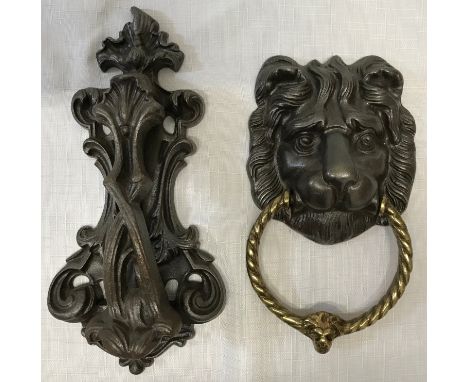 An Art Nouveau cast iron door knocker  25cm l x 12cm w stamped 263 to back together with a cast iron Lion head and brass ring