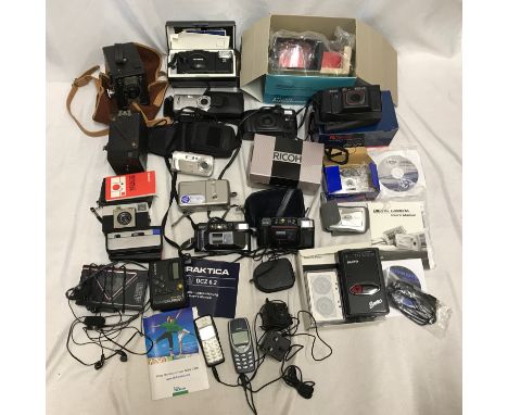 Collection of cameras including 2 old Conway and a box camera, Modern Ricoh, Olympus, Praktika, Polaroid, portable walkman ca