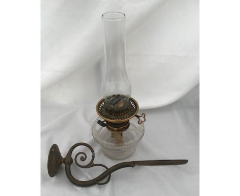 A Hinks &amp; Sons glass wall mounted oil lamp with brass hanging mount. No shade. 19cm h 36cm from wall.Condition ReportUnpo