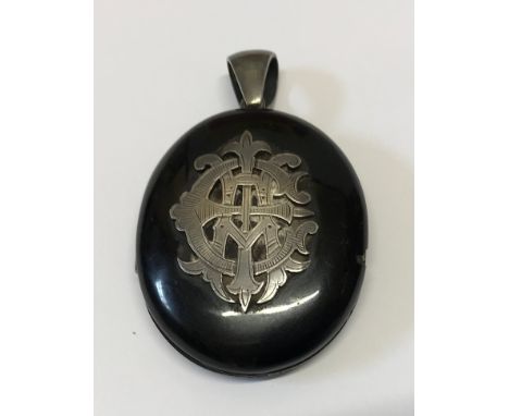 Whitby Jet and Silver pendant locket, hallmarked London 1877 Cornelius Saunders and Frank Shepherd. 4.5 w x 5.5cms h.Conditio
