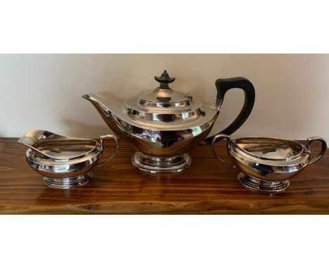A three piece hallmarked silver tea service London 1927 maker Hawksworth Eyre &amp; Co Ltd. Total weight 997.8gms.Condition R