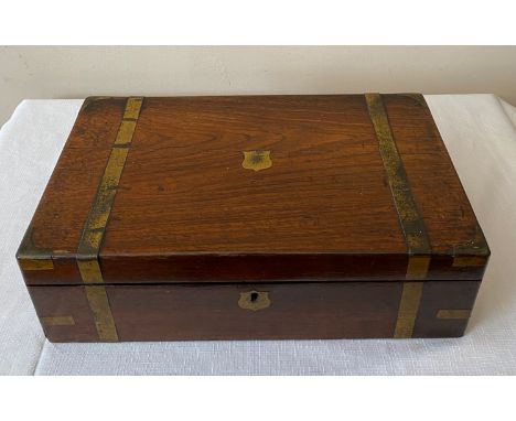 A brass banded mahogany writing box with fitted interior.Condition ReportCrack to top. Split to writing board across the midd