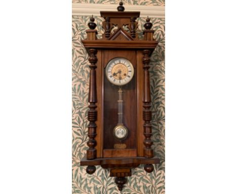 A 19thC mahogany Vienna wall clock with brass and enamel dial and pendulum. 99cms h x 35cms w.Condition ReportGood condition.