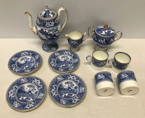 A Wedgwood blue and white part tea set. Country Cottage pattern. To include a teapot 18cm h, cream jug and lidded sugar bowl,