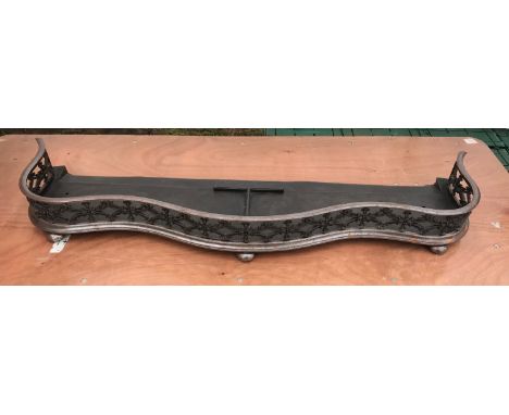 A large cast iron fire fender. 134cm w x 37cm d.Condition ReportLight surface rust, otherwise good condition.