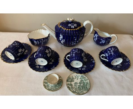 A Copeland part tea set to include a teapot, 4 cups and saucers and sugar bowl together with a miniature Coalport cup, saucer