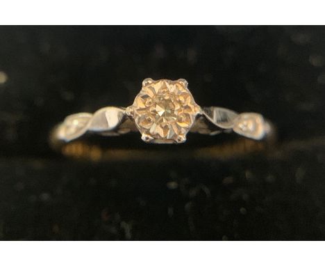 A 18ct gold and platinum diamond set ring in its original display box. Size K/L. 1.7gms.Condition ReportGood condition.