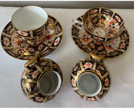 Royal Crown Derby including two cups and saucers and two helmet salts.Condition ReportSlight gilt rub to salts and a chip to 