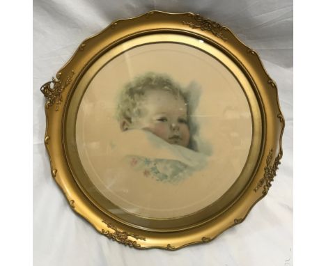 A gilt circular framed Bessie Pease Gutmann baby print "On Dreamlands Border". Print size 33cms x 33 cms. Frame 44cms x 44cms