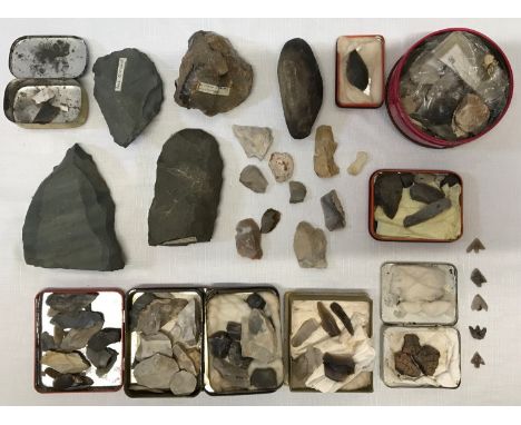 A large collection of possible Palaeolithic and Neolithic axes, flint tools and arrow heads together with archaeological pott