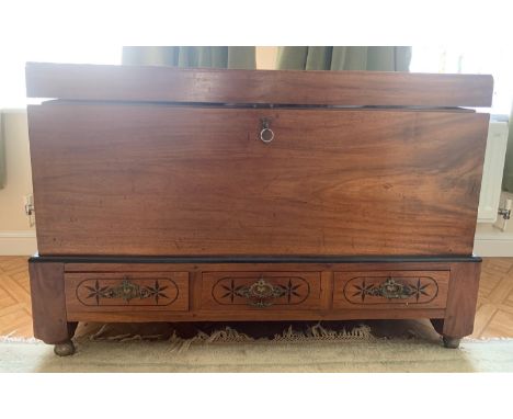 A large Vintage camphorwood trunk with 3 drawers to base. 107cms x 73cms x 52.5cms.Condition ReportGood condition.