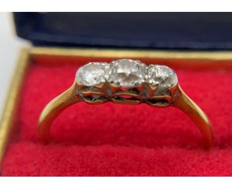 An 18 ct gold and platinum 3 stone ring, 2 of which are diamonds. Size K/L. 1.56gmsCondition ReportShank slightly worn.