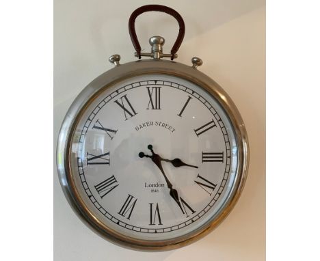 A wall mounted battery operated wall clock. 38cms d.Condition ReportSome scuffs to back.