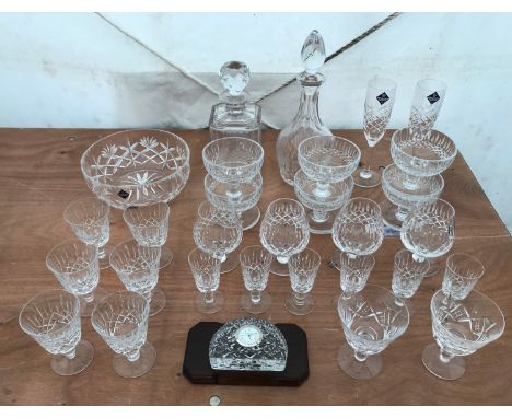 A selection of Edinburgh crystal to include drinking glassware, two decanters, six sundae dishes, a bowl and a small clock on