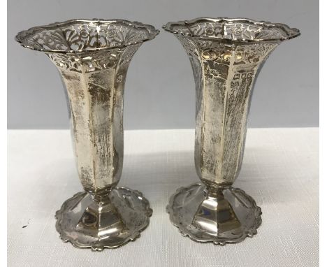 A pair of silver flute vases with pierced tops in an octagonal shape, C. &amp; S. Co. Ltd. London 1903. Approx. 167gms.Condit