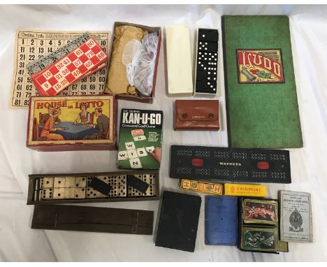 A selection of games to include House or Lotto, Kan U Go, Watney's cribbage board, patience cards and a 55 piece Ebony and Iv