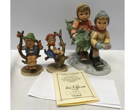 Goebel figurines, Berta Hummel's Tree Trimming Time, with certificate number C2520 approx 15.5cms h and two small Goebel figu