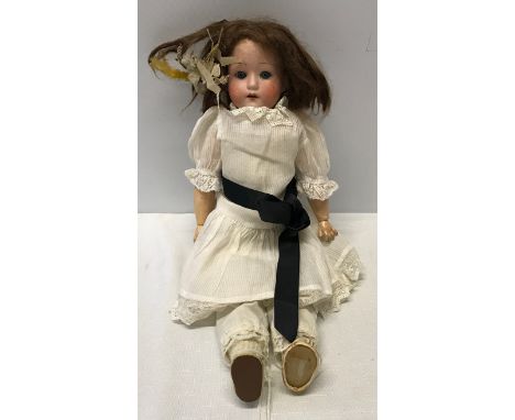 A German pot headed doll stamped to back of the head, with a composite articulated body. Approx 42cm h.Condition ReportNo not