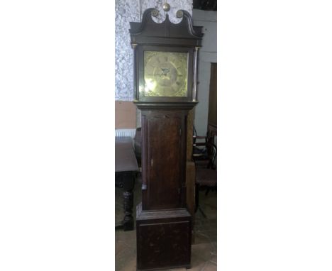 A Thomas Lister of Halifax brass faced oak cased grandfather clock with swan neck top and brass finial. 226cm h x 51cm w x 22