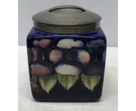 A Tudric pewter mounted dark blue pansy design square biscuit barrel. lid marked H, made in England, Tudric, Moorcroft, 01364