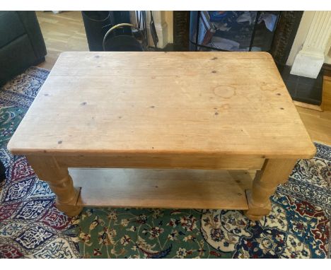 Pine coffee table with shelf to base. 96 l x 61 w x 49cms h.Condition ReportSlight watermarks and faint scratches.