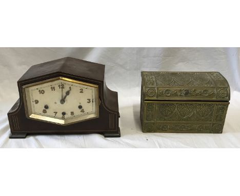 A wooden surround Art Deco style mantel clock with slight clime function and metal inlays 18.5cms h x 29cms l x 14cms w and a