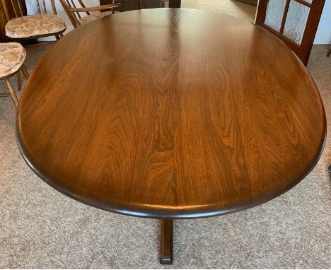 An Ercol pedestal dining table circa 1990's. 166cm l x 121cm w  x 72cm h.Condition ReportSlight surface chips and scratches.