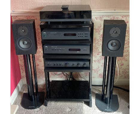 A NAD sound system with Linn speakers mounted on Atacama stands. To include a CD player model C520 and a stereo tuner model C
