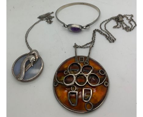 Three pieces of vintage silver jewellery to include a hallmarked silver and enamel pendant by Alistair Norman Grant Edinburgh