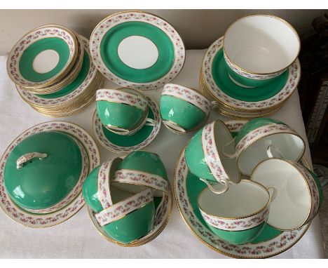 A bone china Aynsley breakfast service retailed by T. Goode and Co Ltd, London. To include a lidded muffin dish, 11 cups, 15 