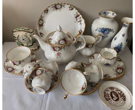 A Royal Albert "Celebration" pattern part tea service to include 6 cups, saucers and plates, a teapot, milk, sugar and  bread