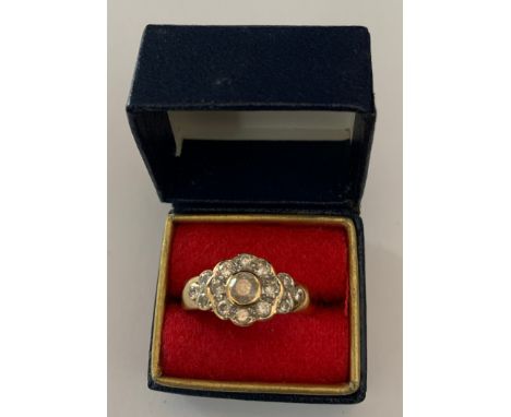 A 9ct gold ladies dress ring set with clear stones (not diamonds), size N. 3.5gms.Condition ReportGood condition.