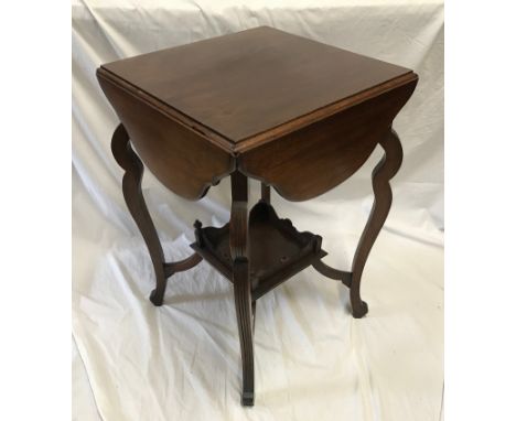 A mahogany four drop leaf games/occasional table with under shelf. Top closed 46cms x 46cms. Open 77cms x 68cms h.Condition R