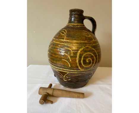 A Michael Cardew Winchcombe Studio Pottery slipware cider flagon with Winchcombe seal marks to base. Height approx. 39cm and 