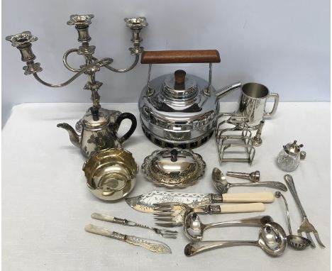 A collection of silver plate wares to include a candelabra 28cm, teapot, muffin dish, toast rack, ladles, carving set and chr