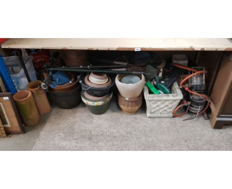 Three vintage gas lights, together with a large quantity of planters, terracotta drain pipes, garden tools, collection of pri