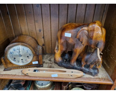 A wooden carved elephant figure, mantle clock &amp; a Crossley's spinning shuttle
